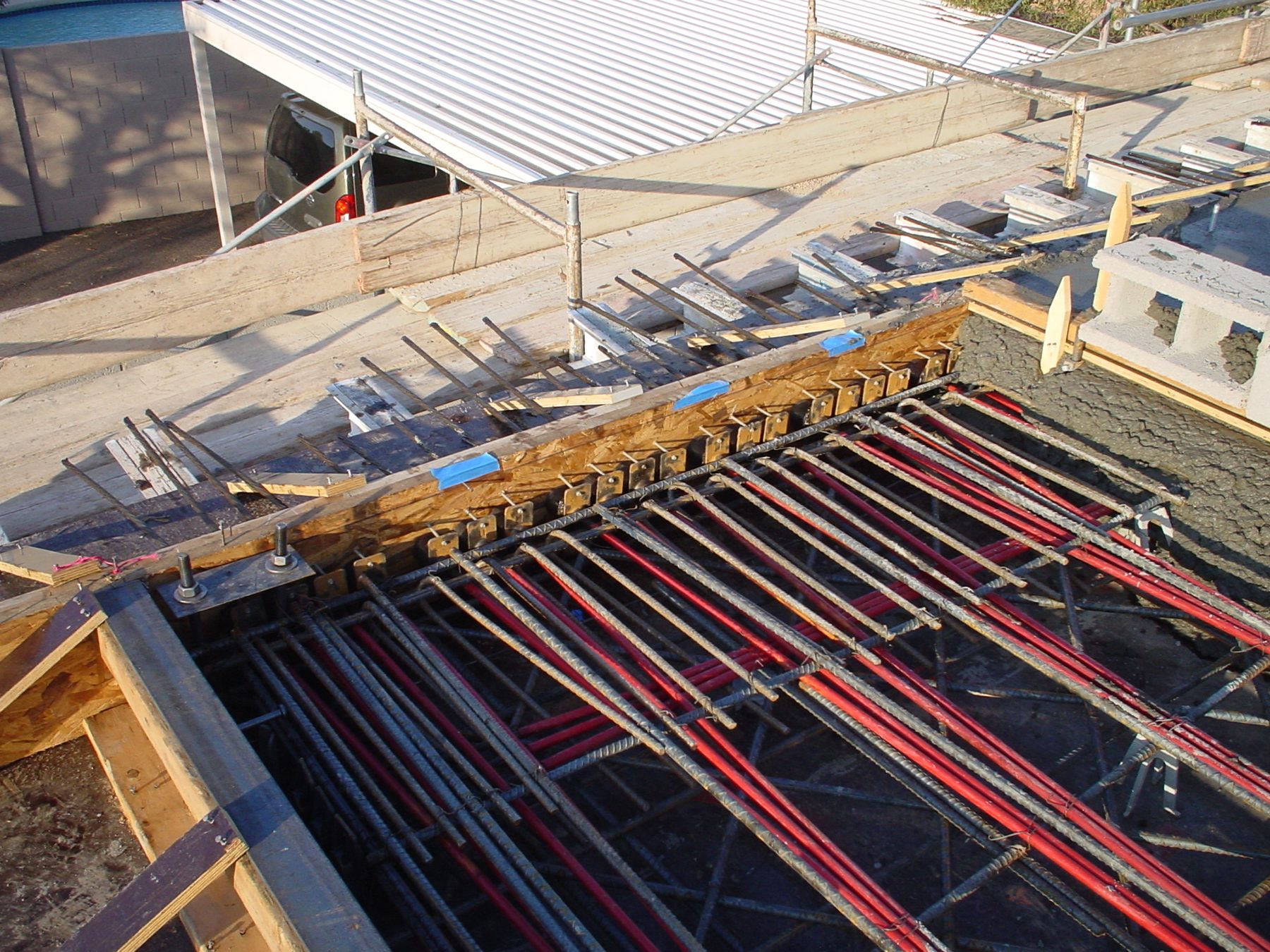 Post-tension cables and rebar laid out before a slab pour
